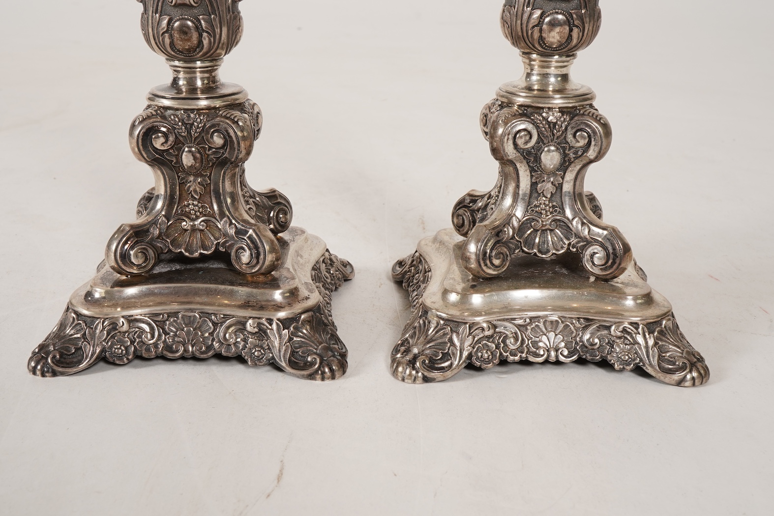 A pair of late 18th/early 19th century German white metal candlesticks, maker's mark W.C.H & S